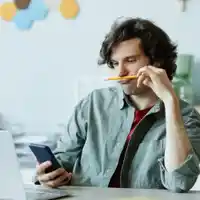 Photo of a man procrastinating at work